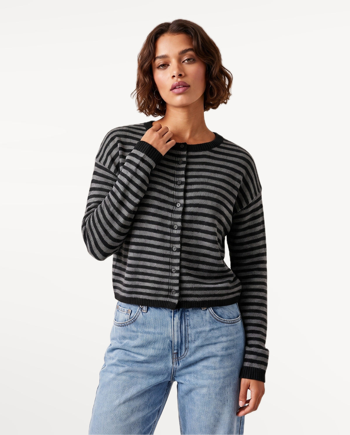 Almondine Stripe Cardigan in Black – hands on hips | SKU: SOR-ALM-BLACK-XS,SOR-ALM-BLACK-S,SOR-ALM-BLACK-M,SOR-ALM-BLACK-L,SOR-ALM-BLACK-XL