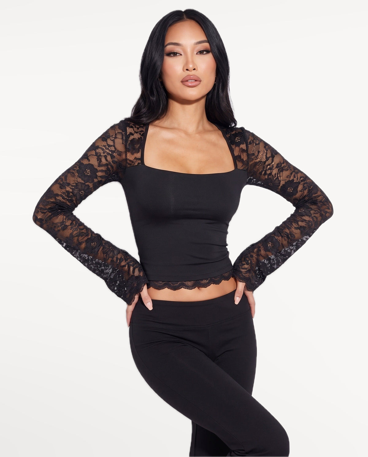 Amara Lace Top in Black – emotional pose | SKU: SOR-AMARA-BLK-XS,SOR-AMARA-BLK-S,SOR-AMARA-BLK-M,SOR-AMARA-BLK-L,SOR-AMARA-BLK-XL