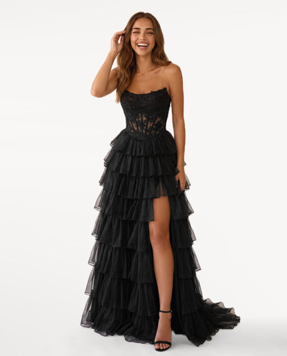 Elara Maxi Dress in Black – emotional pose | SKU: SOR-ELARA-BLK-XS,SOR-ELARA-BLK-S,SOR-ELARA-BLK-M,SOR-ELARA-BLK-L,SOR-ELARA-BLK-XL