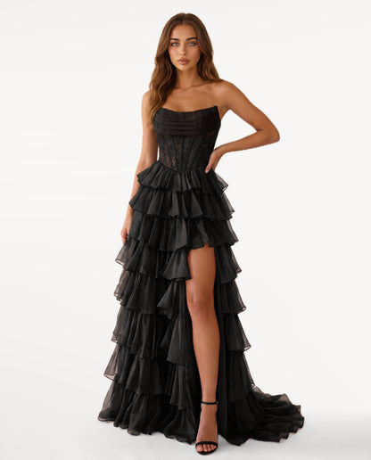 Elara Maxi Dress in Black – emotional pose | SKU: SOR-ELARA-BLK-XS,SOR-ELARA-BLK-S,SOR-ELARA-BLK-M,SOR-ELARA-BLK-L,SOR-ELARA-BLK-XL